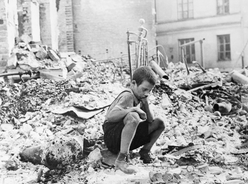A boy amidst the destructions by war, international day of peace, global education magazine